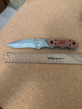 CAT folding knife and sheath